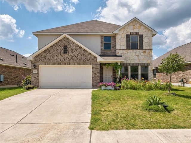 view of front of property with a garage and a front yard