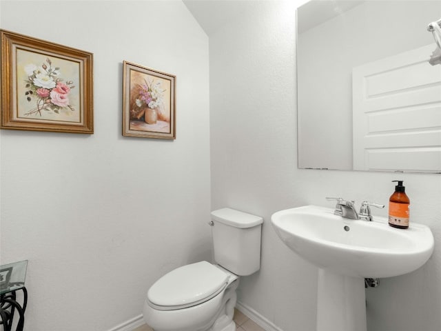 bathroom featuring toilet and tile patterned floors