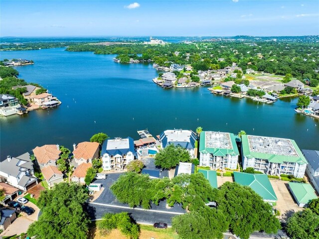 birds eye view of property with a residential view and a water view