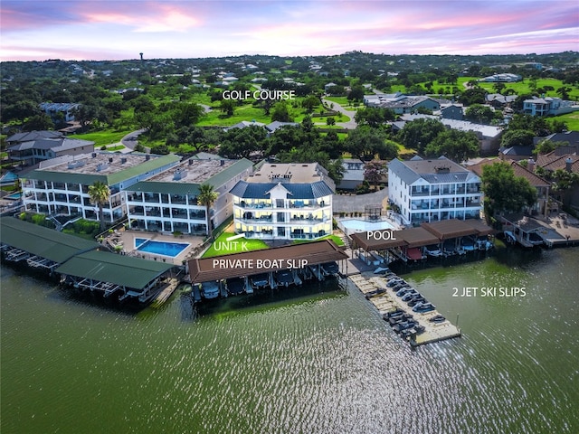 aerial view at dusk with a water view