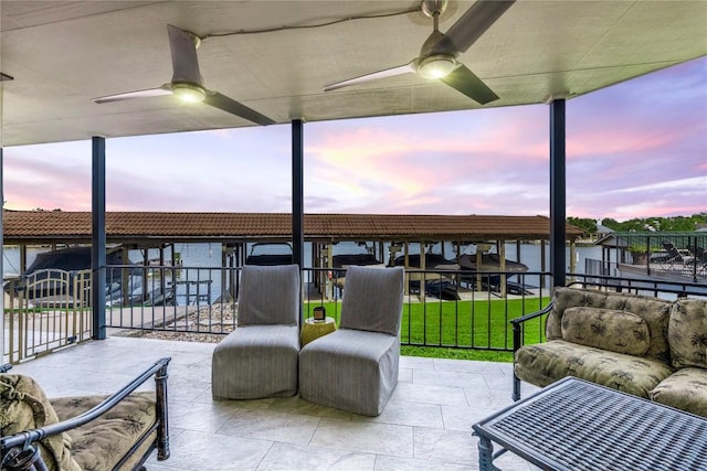 view of patio terrace at dusk