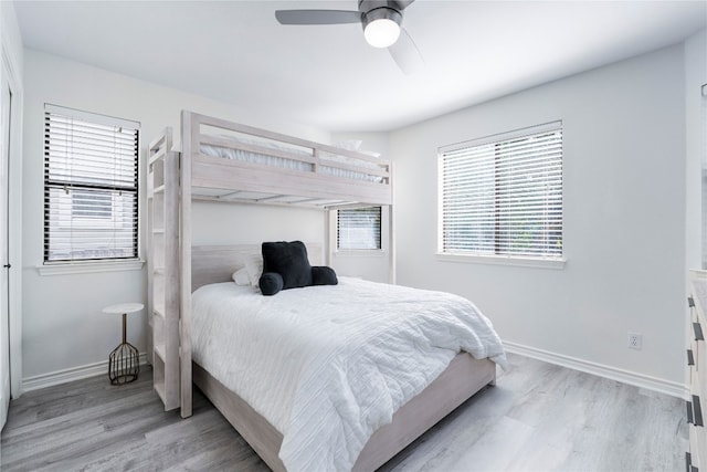 bedroom featuring ceiling fan and light hardwood / wood-style flooring