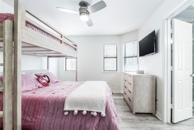 bedroom with ceiling fan and light wood-type flooring