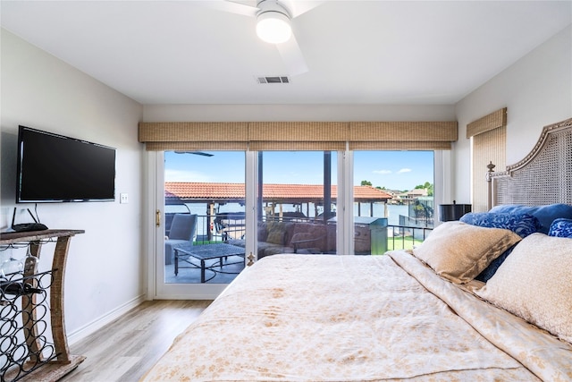 bedroom with ceiling fan, hardwood / wood-style floors, and access to outside