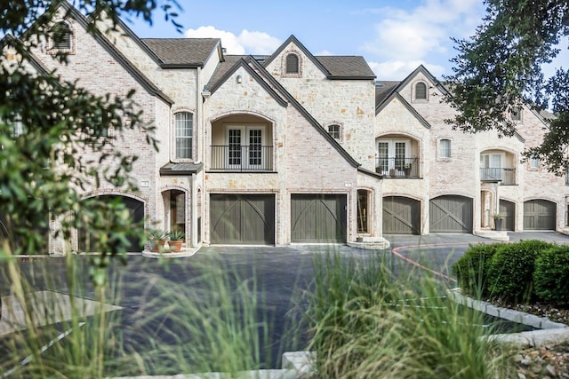 french country inspired facade featuring a balcony