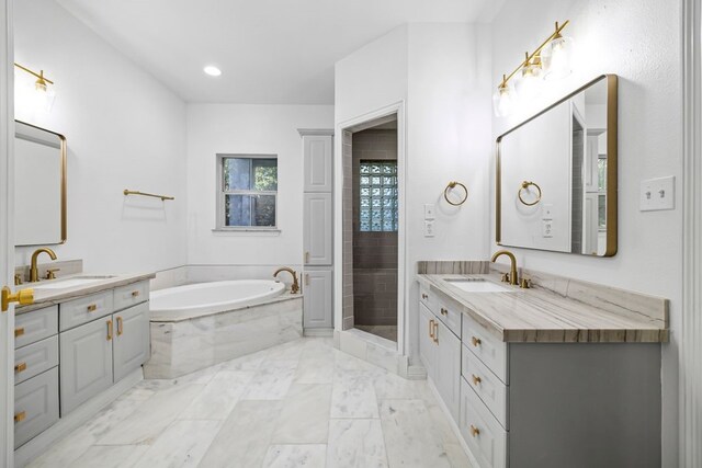 bathroom featuring plus walk in shower and vanity