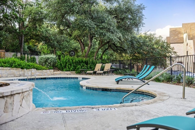 view of swimming pool featuring a patio