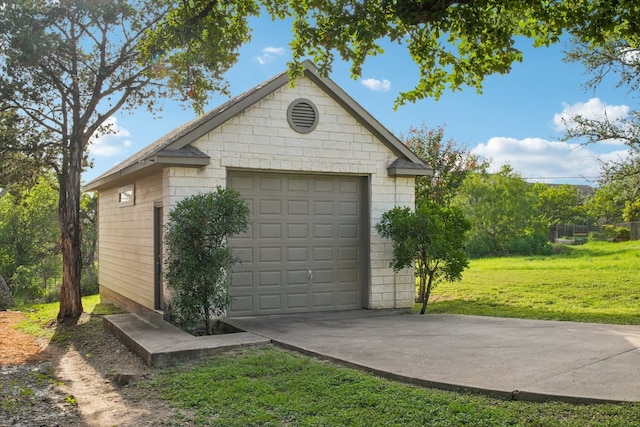 garage featuring a lawn