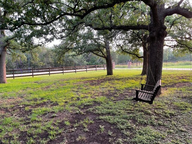 view of yard with a rural view