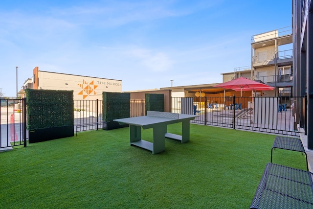 view of yard with a balcony