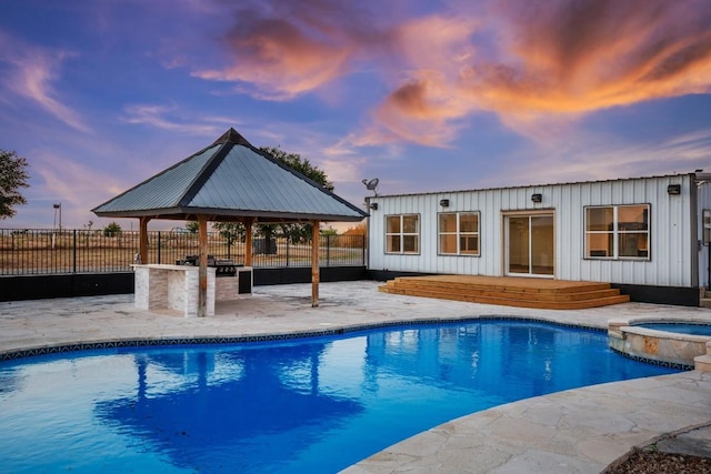 14409 Bois D Arc Ln, Manor, TX 78653 - view of pool with a gazebo, a wooden deck, a pool with connected hot tub, and fence