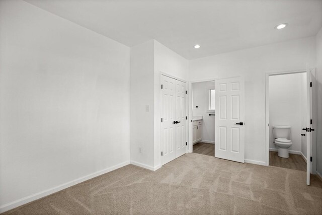 14409 Bois D Arc Ln, Manor, TX 78653 - unfurnished bedroom featuring ensuite bath, recessed lighting, carpet, and baseboards