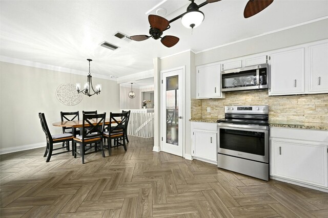 kitchen featuring white cabinets, ceiling fan with notable chandelier, backsplash, stainless steel appliances, and parquet floors