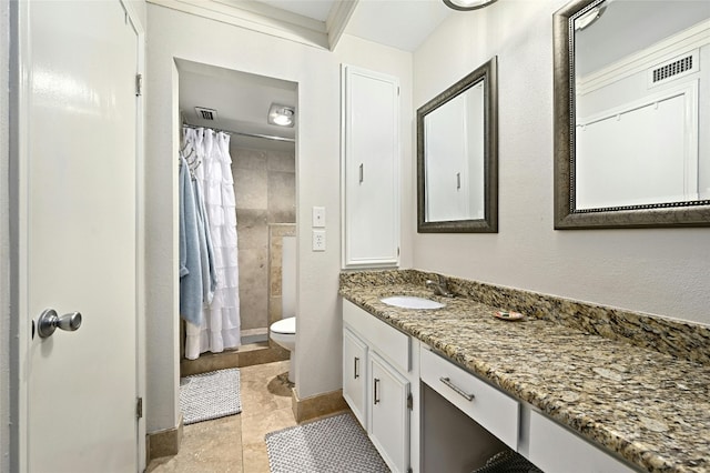 bathroom featuring ornamental molding, vanity, tile patterned flooring, and toilet