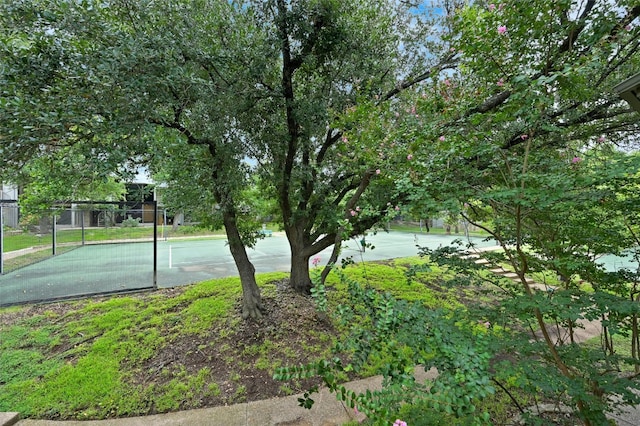 view of tennis court with basketball court