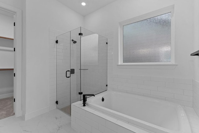 bathroom with separate shower and tub