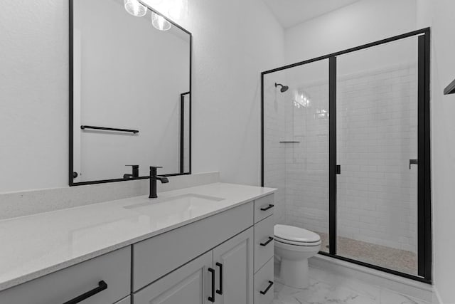 bathroom featuring vanity, toilet, and an enclosed shower