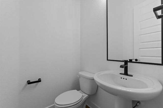 bathroom with toilet and sink