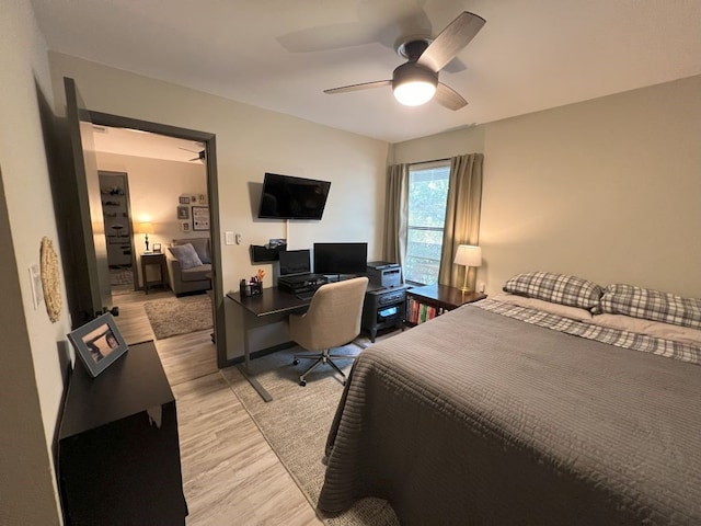 bedroom featuring light hardwood / wood-style flooring and ceiling fan