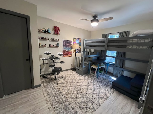 bedroom with wood-type flooring and ceiling fan