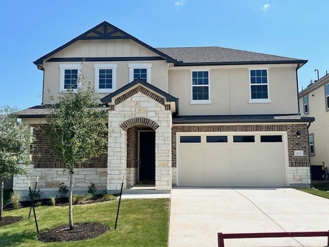 view of front of house featuring a garage and a front yard