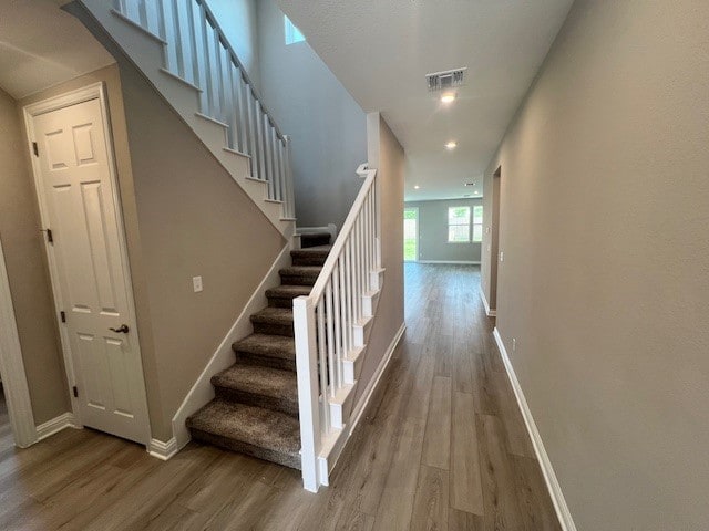 stairs with wood-type flooring