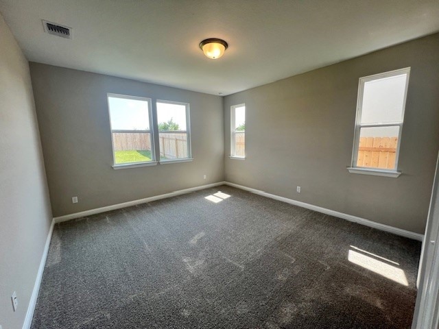 spare room featuring carpet flooring