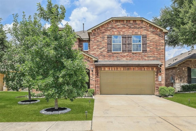 view of front of home featuring an attached garage, concrete driveway, brick siding, and a front yard