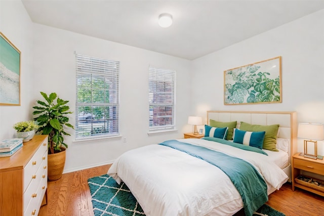 bedroom with hardwood / wood-style floors