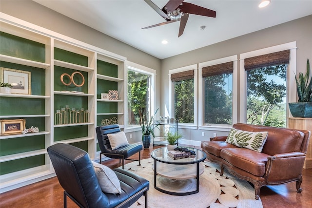 interior space with ceiling fan