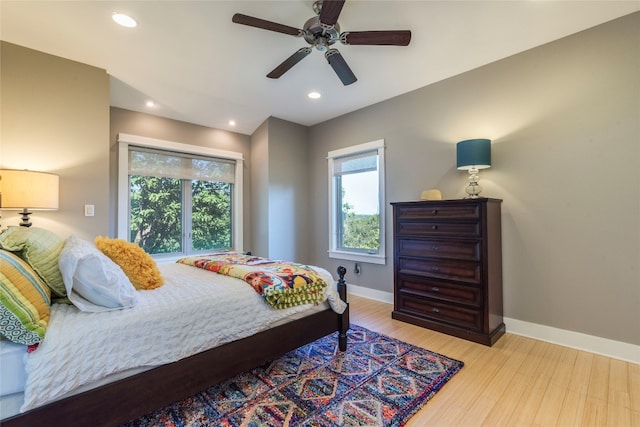 bedroom featuring ceiling fan and light hardwood / wood-style flooring