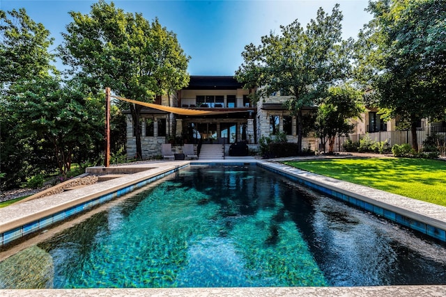 view of swimming pool with a yard and a patio area