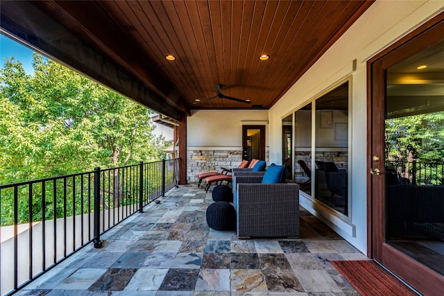 exterior space featuring a balcony and ceiling fan