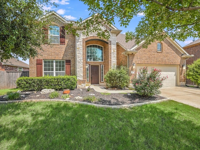 view of front property featuring a garage and a front yard