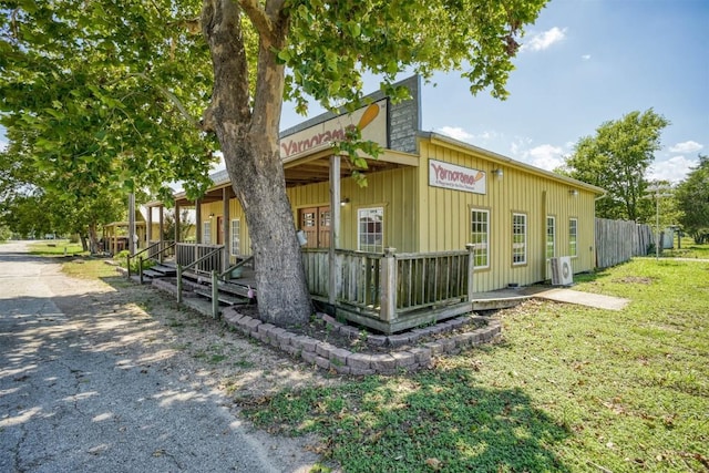 128 Gonzales St, Paige, TX 78659 - view of side of home with board and batten siding