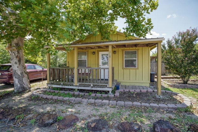128 Gonzales St, Paige, TX 78659 - view of outdoor structure featuring covered porch