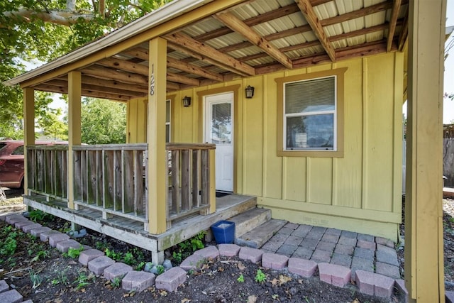 128 Gonzales St, Paige, TX 78659 - entrance to property featuring a wooden deck and board and batten siding