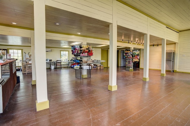 garage with wood ceiling and wood walls