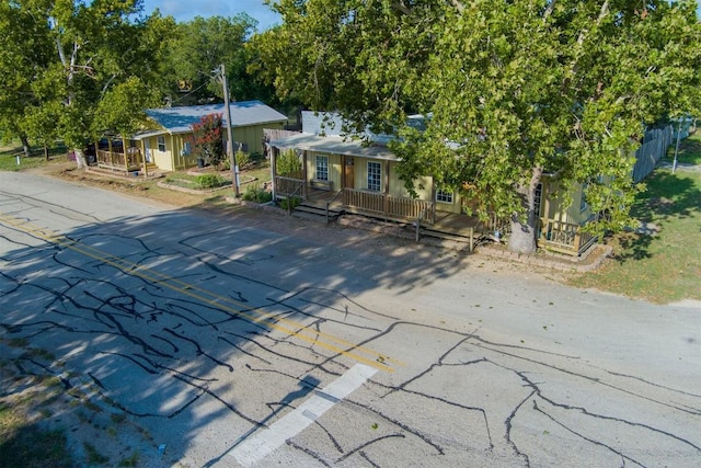 128 Gonzales St, Paige, TX 78659 - view of front facade with covered porch