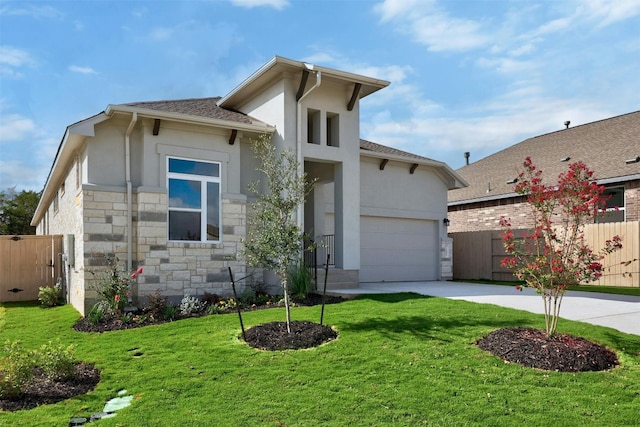 view of front of house with a front yard and a garage