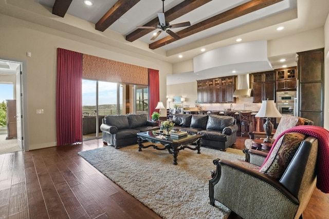 living room with dark hardwood / wood-style flooring, beamed ceiling, and ceiling fan