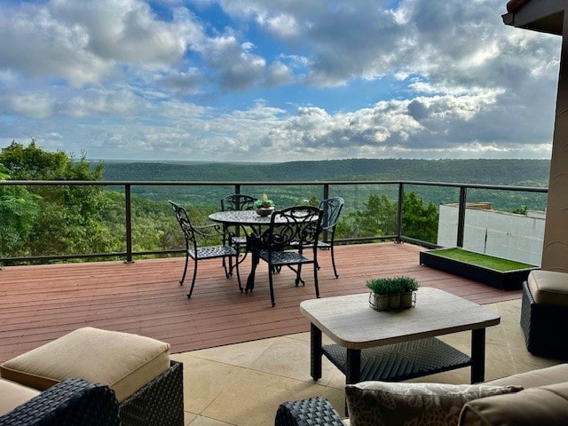 wooden terrace with a water view