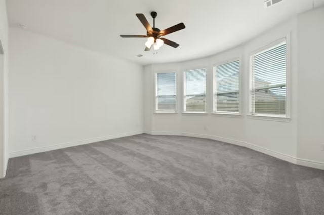 unfurnished room with carpet flooring and ceiling fan