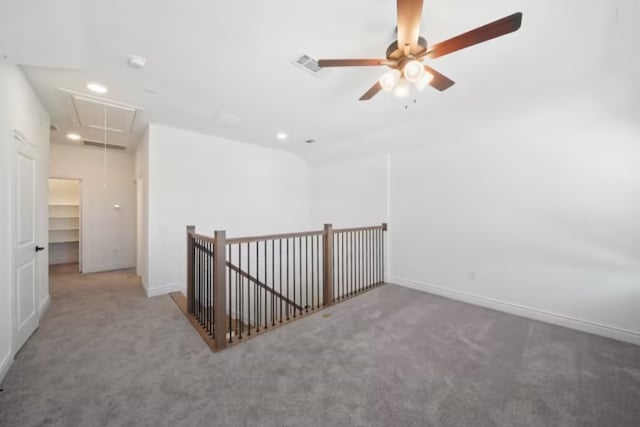 interior space with carpet and ceiling fan