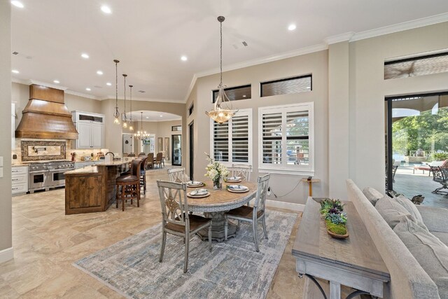 911 Legends Pkwy, Kingsland, TX 78639 - dining area with a chandelier, recessed lighting, ornamental molding, and baseboards