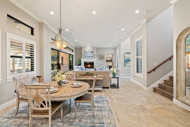 dining space featuring crown molding and light tile patterned floors