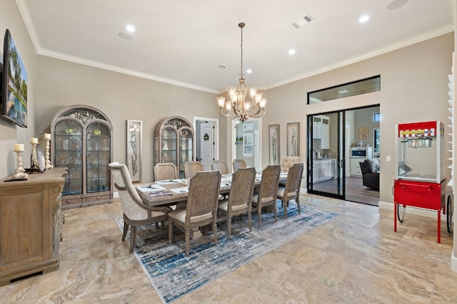 911 Legends Pkwy, Kingsland, TX 78639 - dining room with a chandelier, crown molding, recessed lighting, and light marble finish floors