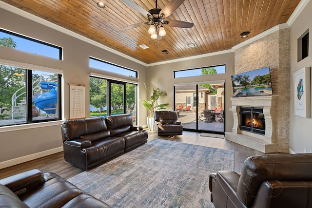 living room featuring wood ceiling, ceiling fan, light hardwood / wood-style flooring, and ornamental molding