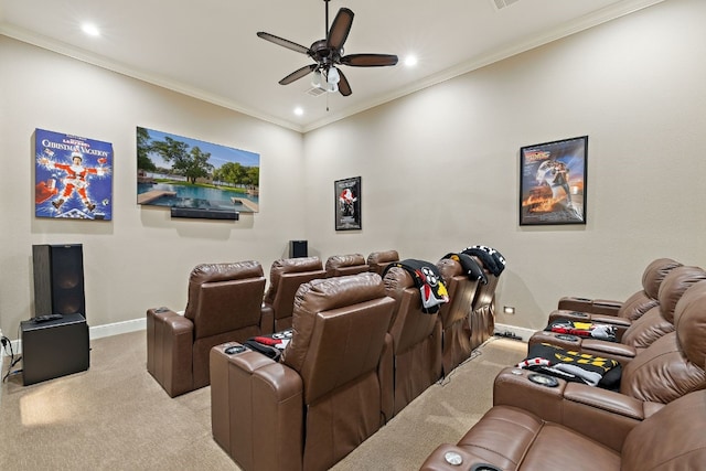 carpeted home theater featuring ceiling fan and crown molding