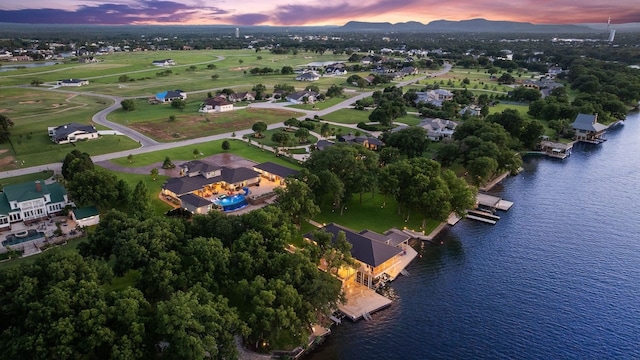 aerial view at dusk with a water view